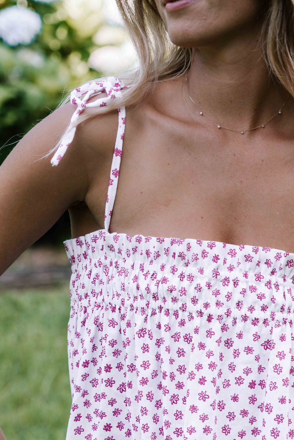 womens slip on maxi dress pink magenta flower floral print on a white background rouched tie up top strappy shoulders very flattering fit versatile wear through the seasons