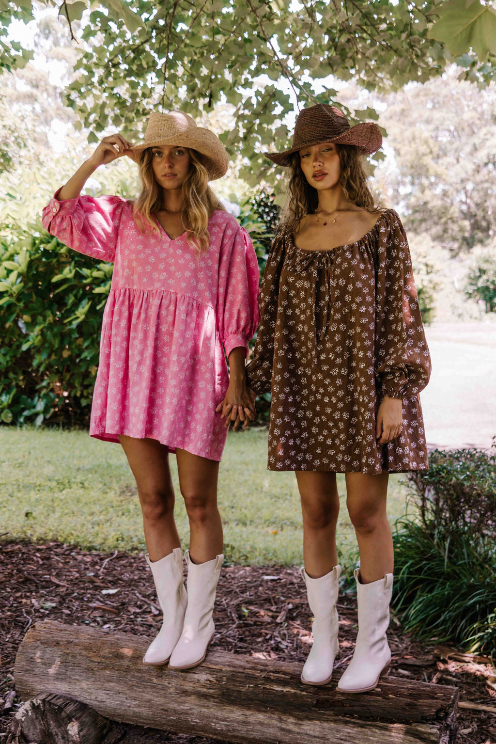 drawstring neckline shift mini dress with a statement balloon long sleeve with elastic wrists, rounded neckline with adjustable bow tie at the front. Hand painted white flower print on a dark mocha brown cotton linen fabric.