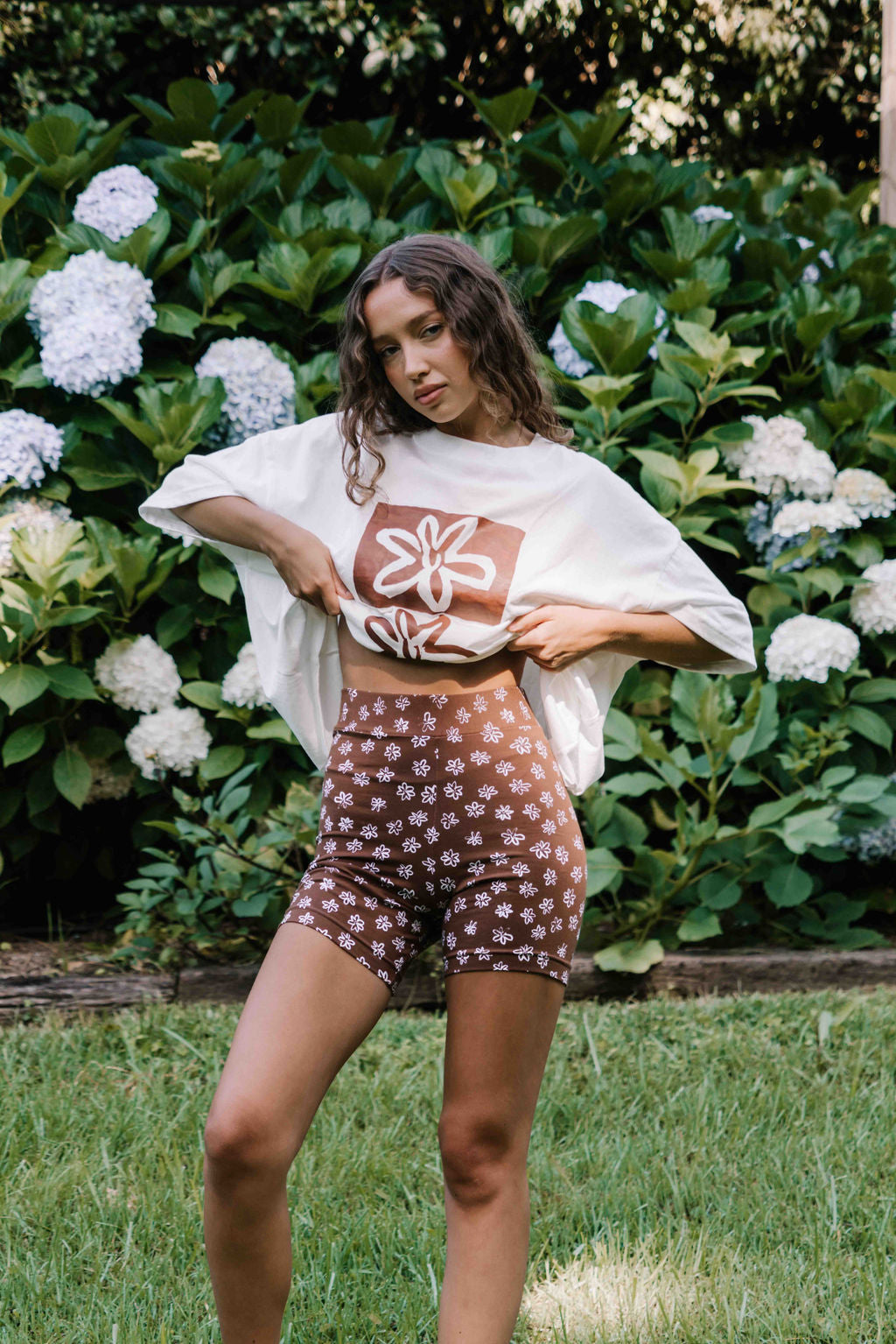 womens bike pants active leisure wear stretch cotton with a hand paointed flower floral print in white on a dark mocha brown cotton fabric
