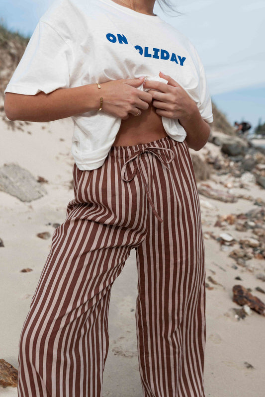 womens wide leg full length relaxed fit pant in a vibrant choc brown and cream cotton linen fabric with a hand painted striped print elastic waist with drawstring wide leg fit to the ankles