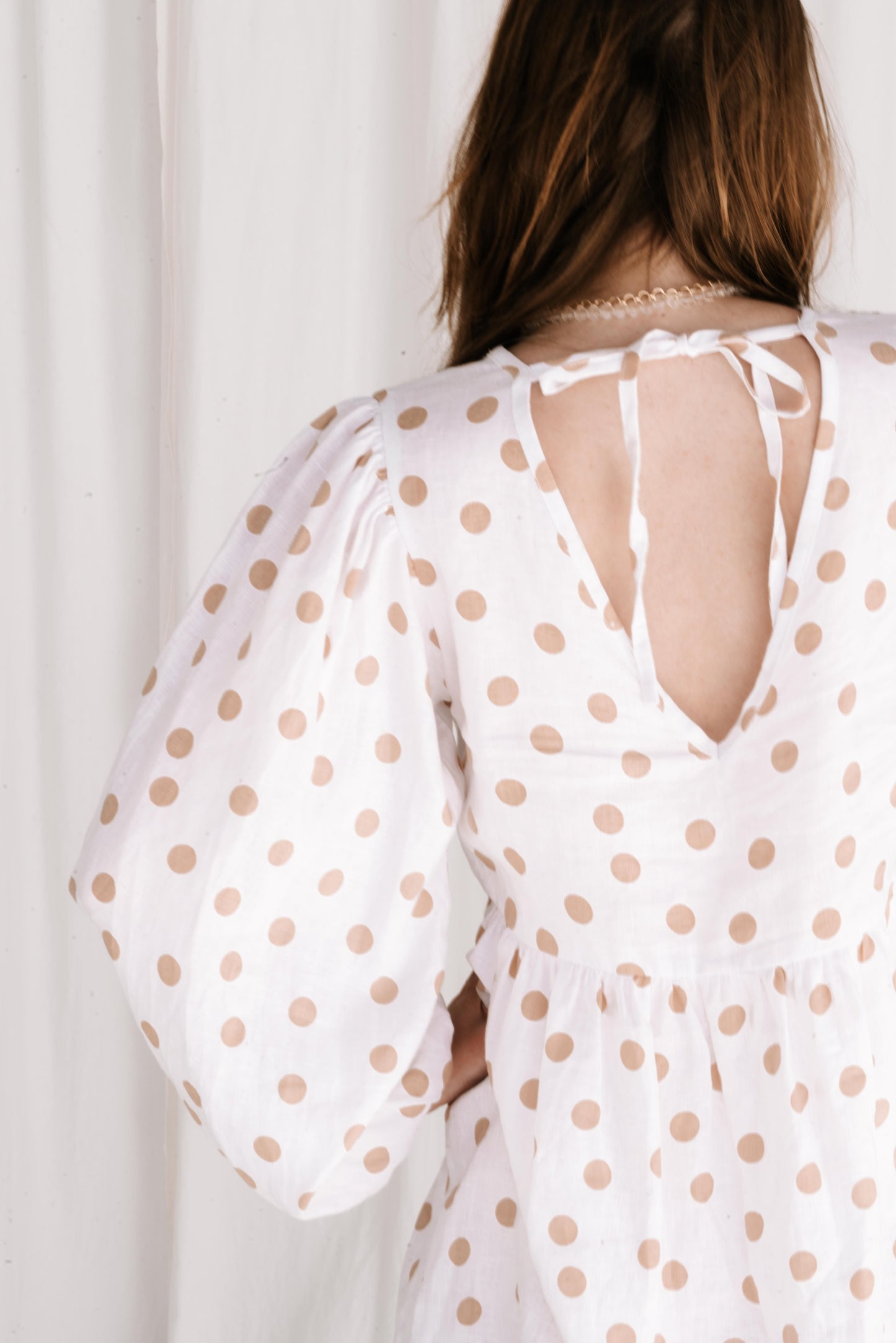statement long puff sleeve polkadot dress beige and white on linen dress with v front, flattering shape, elastic cuffs flowy fit ties at back with adjustable straps short dress high quality linen