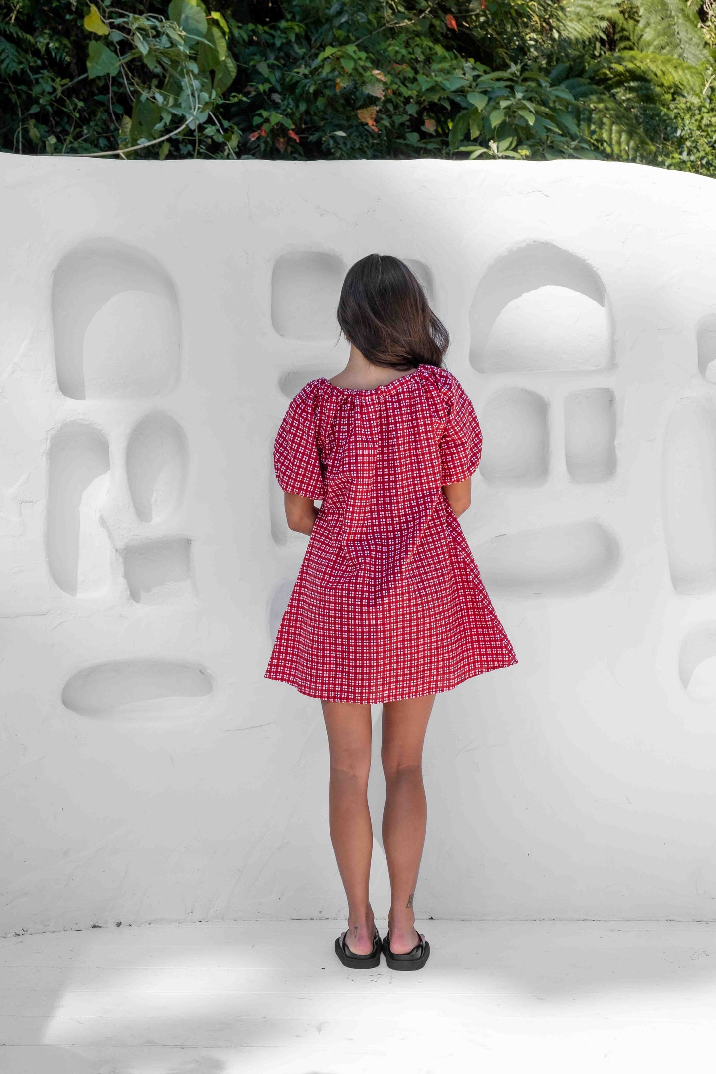 a line smock dress with a drawstring neckline and statement tie at the front puffy short sleeves in a beautiful red gingham linen cotton fabric