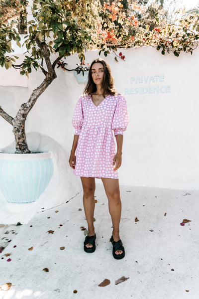 womens v neck smock made from 100% highest quality linen. A flattering cut with an adjustable back tie. Puffed 3/4 sleeves and a drop waist with a short dress length. Super comfortable dress, adjustable back tie and in a floral flower print. 100% high quality linen.