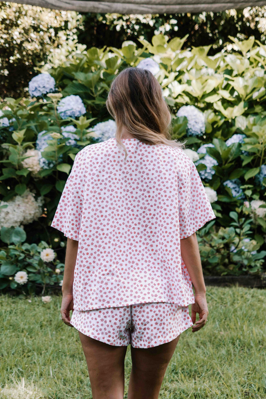 tie front blouse, boxy fit, centre front ties, sleeves to the elbow, small orange coral flower floral print, womens top