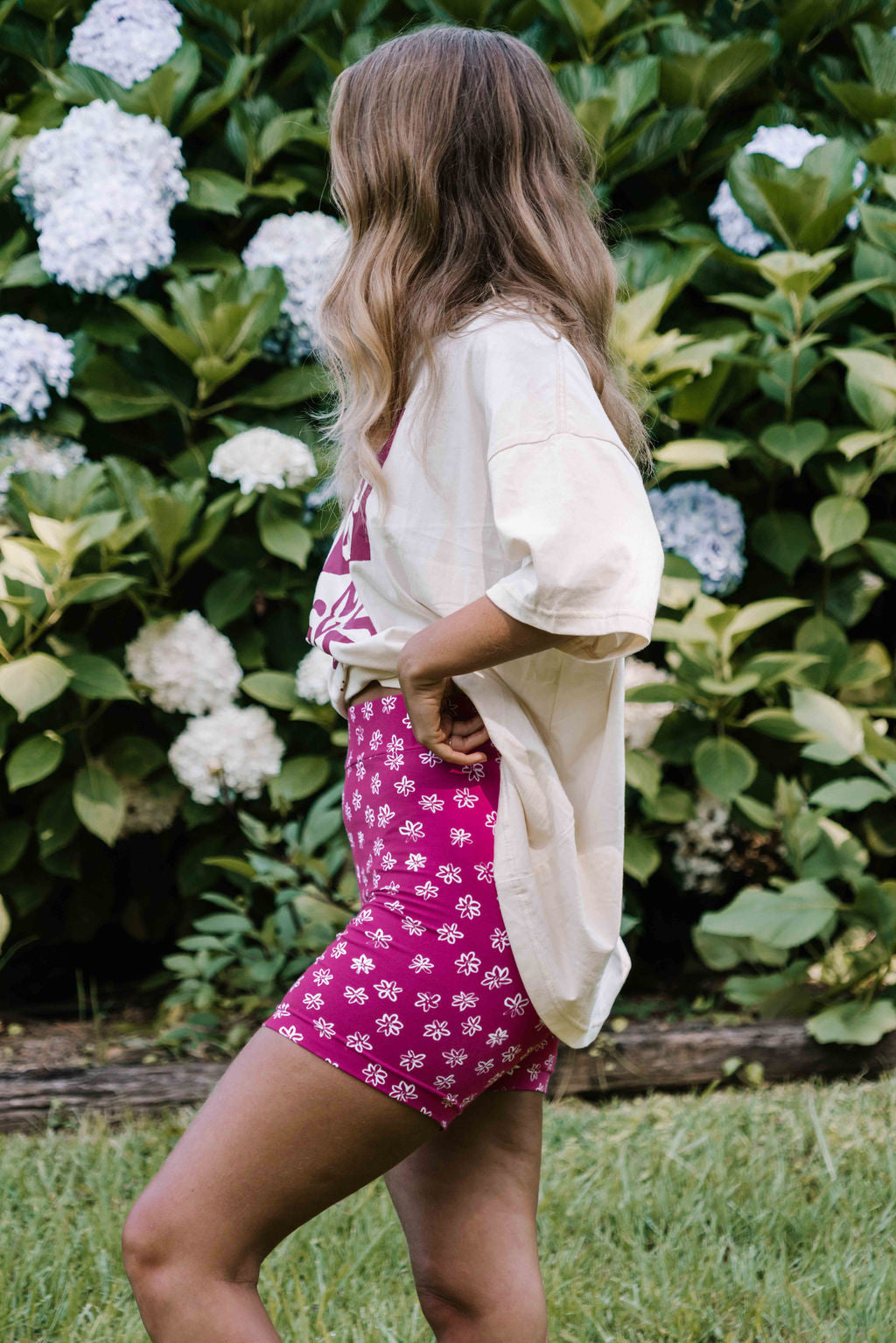 womens bike pants active leisure wear stretch cotton with a small flower floral print in white on a bright magenta pink