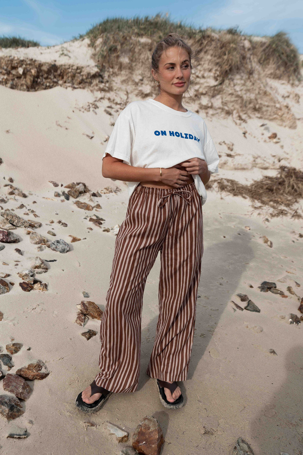 womens wide leg full length relaxed fit pant in a vibrant choc brown and cream  cotton linen fabric with a hand painted striped print  elastic waist with drawstring wide leg fit to the ankles