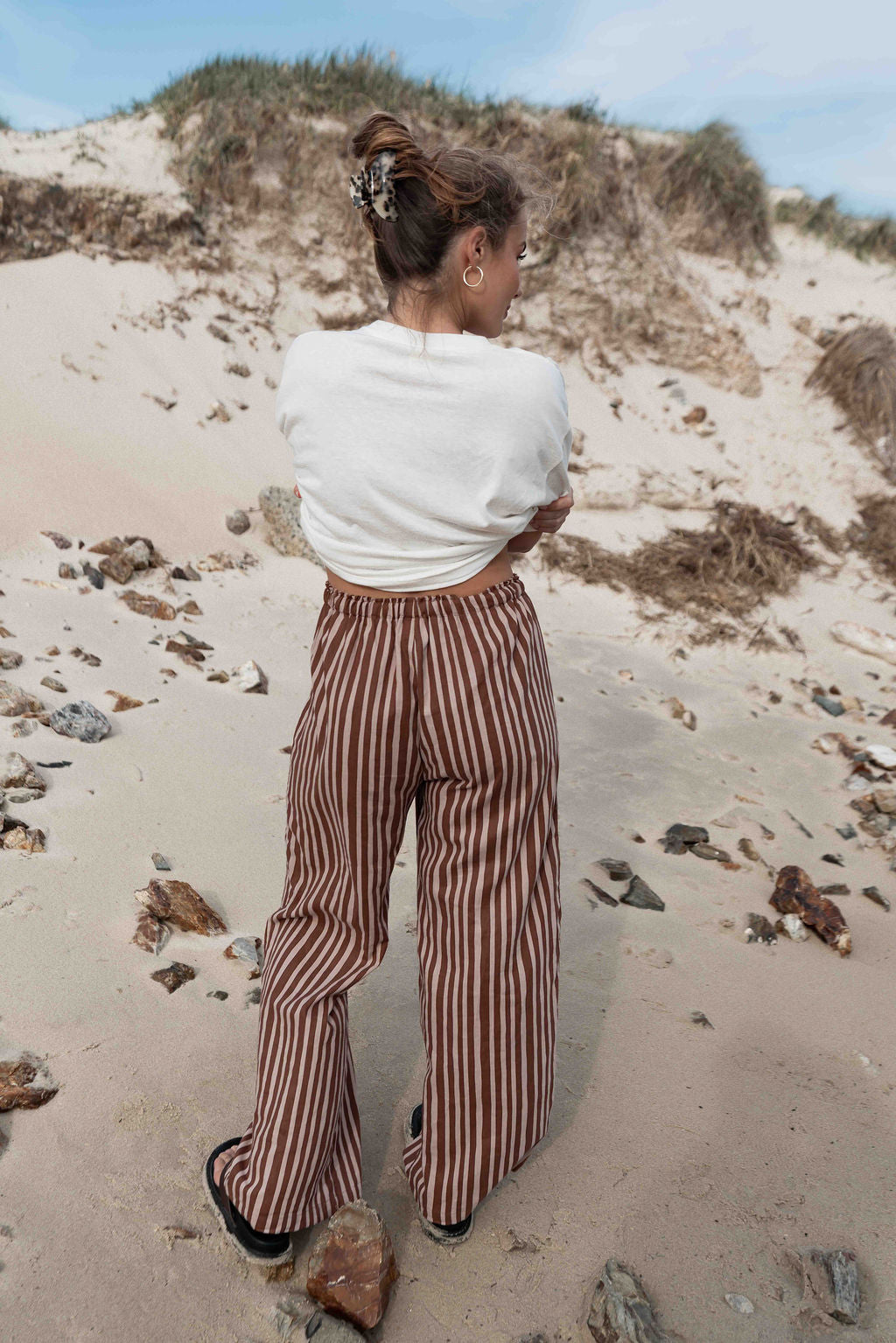 womens wide leg full length relaxed fit pant in a vibrant choc brown and cream  cotton linen fabric with a hand painted striped print  elastic waist with drawstring wide leg fit to the ankles