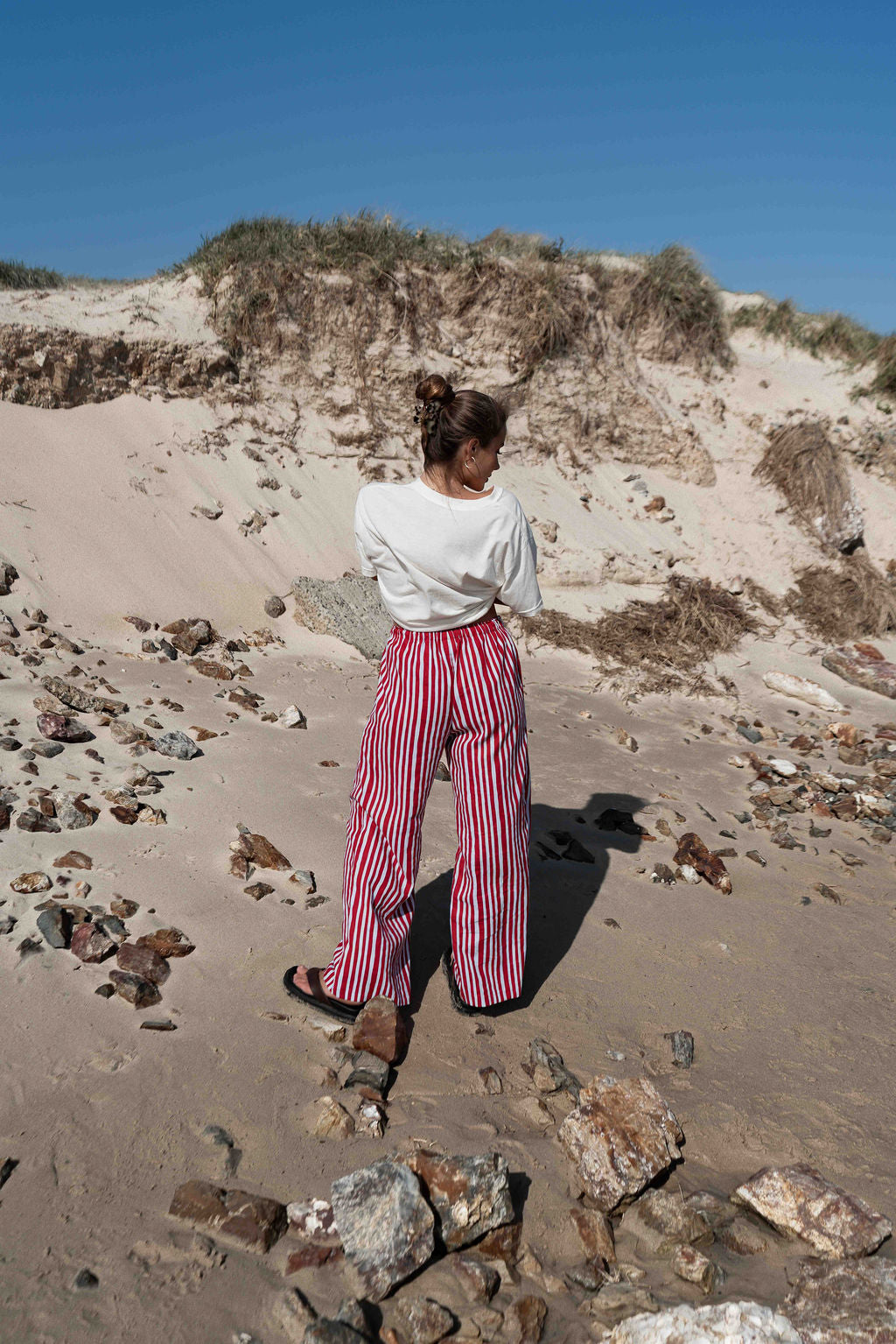 womens wide leg full length relaxed fit pant in a vibrant red and baby blue cotton linen fabric with a hand painted striped print  elastic waist with drawstring wide leg fit to the ankles