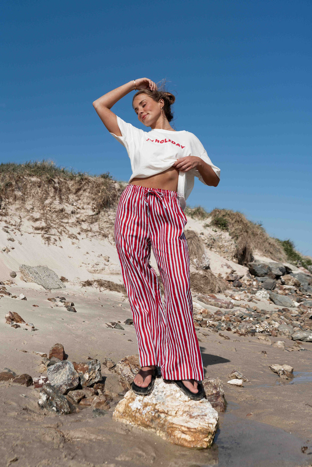 womens wide leg full length relaxed fit pant in a vibrant red and baby blue cotton linen fabric with a hand painted striped print  elastic waist with drawstring wide leg fit to the ankles