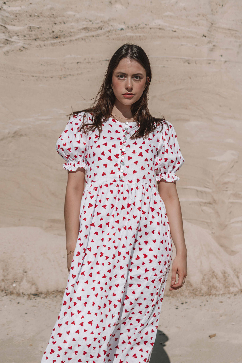 womens midi dress with button through front puffed short sleeves with a beautiful red love heart print
