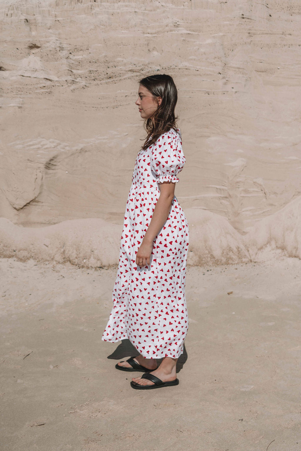 womens midi dress with button through front puffed short sleeves with a beautiful red love heart print
