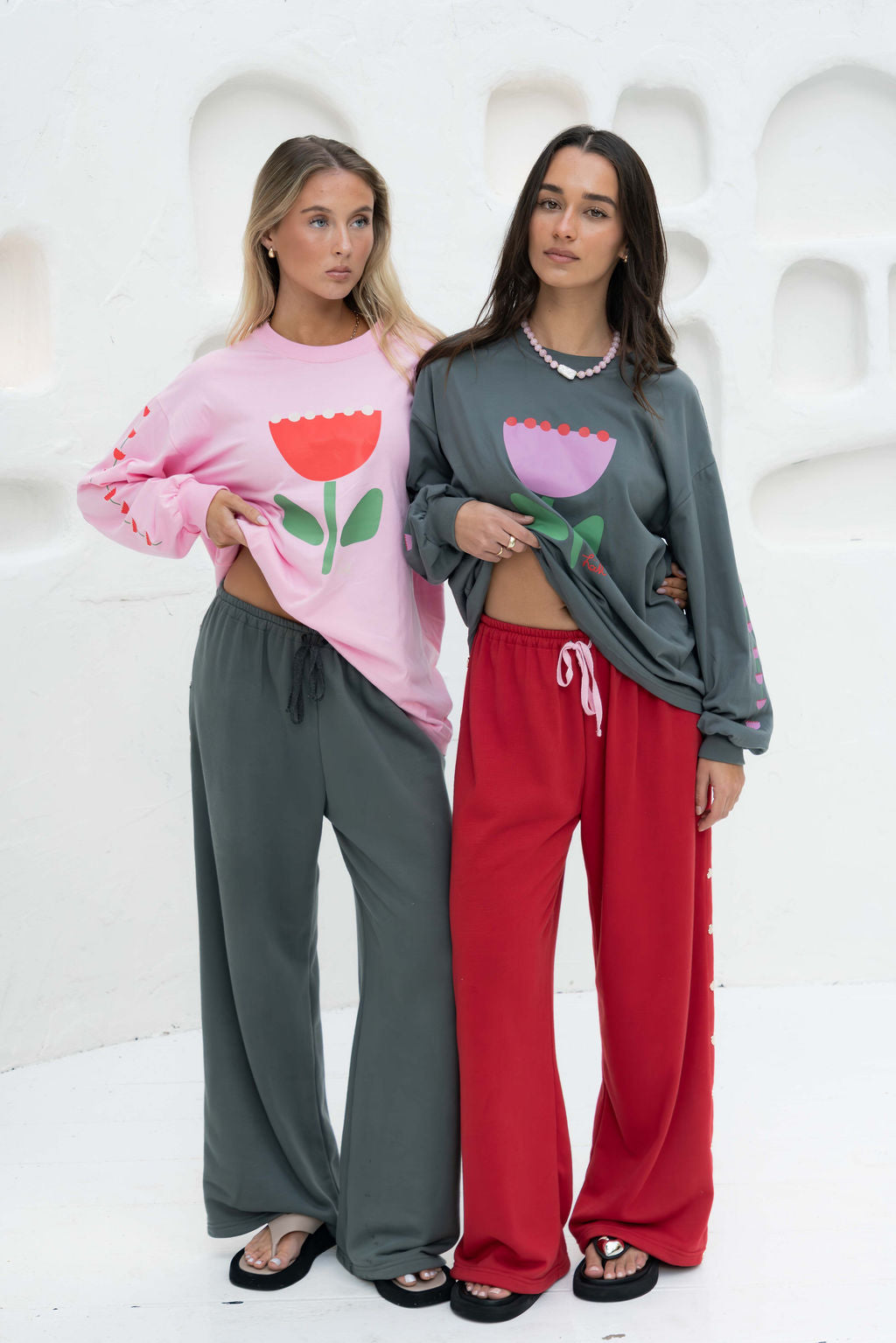  womens wide leg full length relaxed fit pant in a grey terry cotton fabric with a black drawstring and silver heart shape push studs down each leg wide leg fit to the ankle