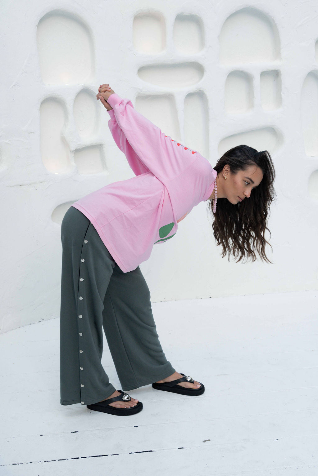womens wide leg full length relaxed fit pant in a grey terry cotton fabric with a black drawstring and silver heart shape push studs down each leg wide leg fit to the ankle