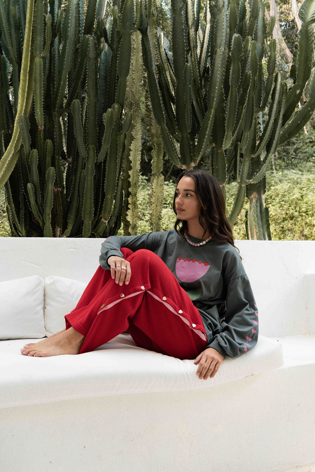 womens wide leg full length relaxed fit pant in a red terry cotton fabric with a pink drawstring and gold heart shape push studs down each leg wide leg fit to the ankle