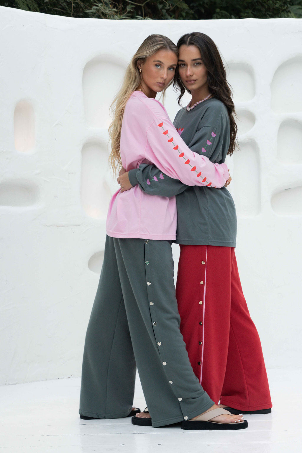 womens wide leg full length relaxed fit pant in a grey terry cotton fabric with a black drawstring and silver heart shape push studs down each leg wide leg fit to the ankle