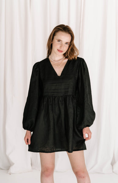 statement long puff sleeve black linen dress with v front, flattering shape, elastic cuffs flowy fit ties at back with adjustable straps short dress high quality linen