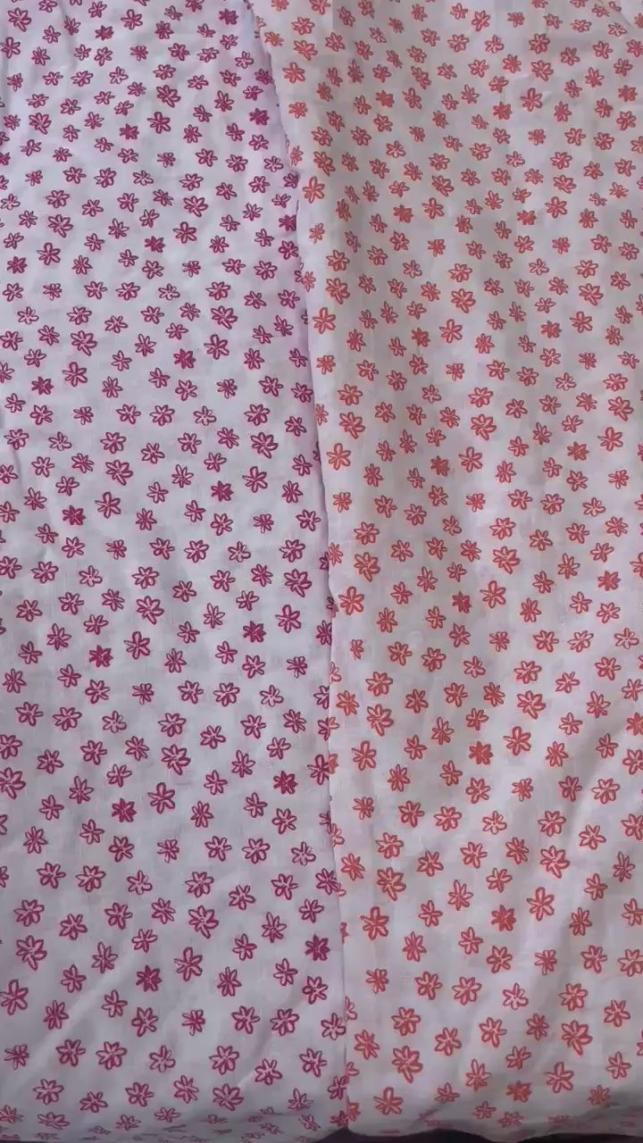 womens shorts with elastic waist and pockets, high waisted but can be worn lower small flower floral print in poink magenta colour on white background