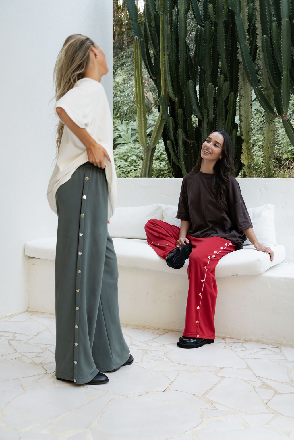 womens wide leg full length relaxed fit pant in a grey terry cotton fabric with a black drawstring and silver heart shape push studs down each leg wide leg fit to the ankle
