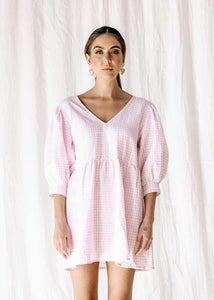 womens v neck smock made from 100% highest quality linen. A flattering cut with an adjustable back tie. Puffy 3/4 sleeves & a drop waist. Comfortable & classy allowing you to go effortlessly from day to night.