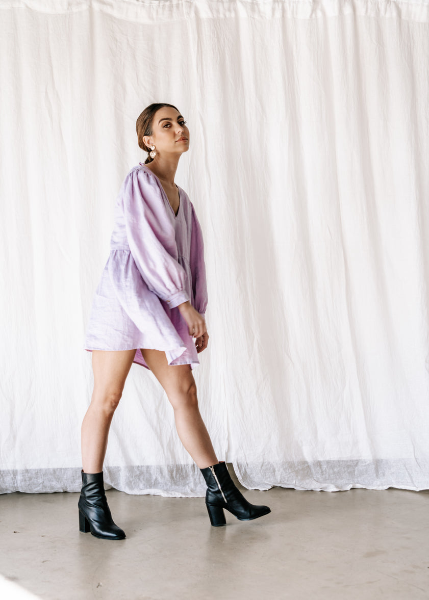 100% linen smock dress with v front. Comfortable, cool & versatile. Exclusively dyed linen in lilac. Ethically made in indonesia.